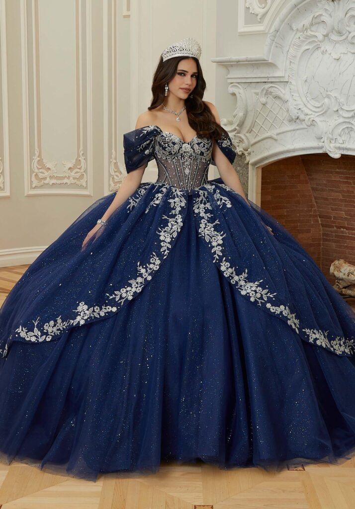 a dark blue quinceañera dress with silver details