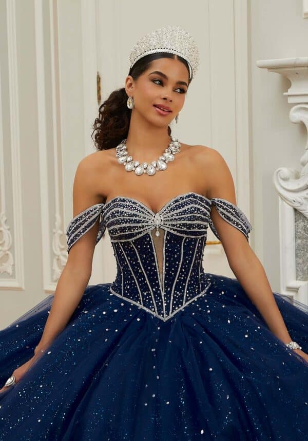 navy blue quinceanera dress with a silver-detailed bodice