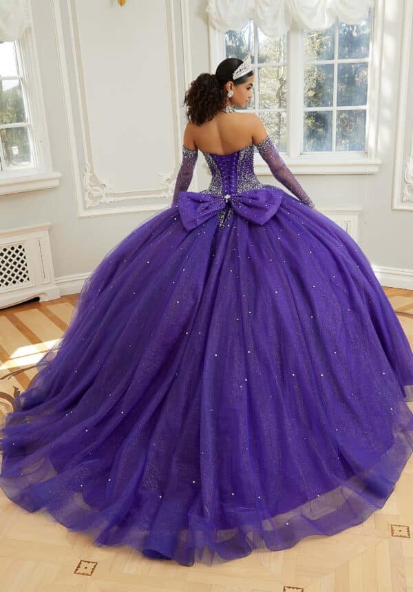 the back of a purple quince dress with a bow