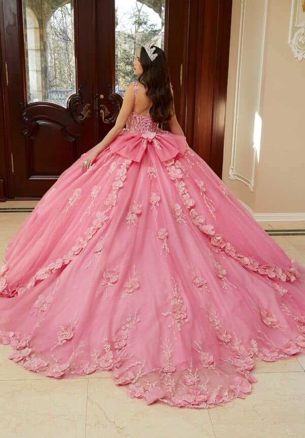 a quinceanera gown with a bow